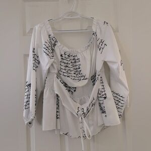 SHEIN Curve Slogan Graphic Off Shoulder Frill Trim Grommet Lace Peplum Blouse